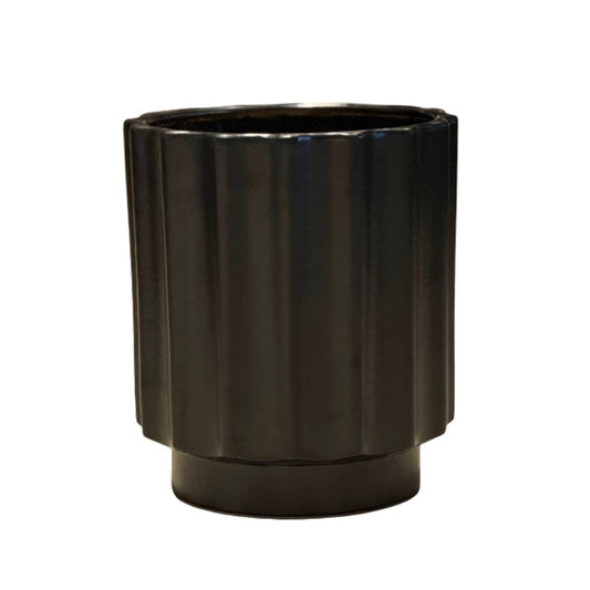 Black cylindrical planter on a white background
