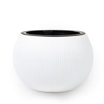 Round  ceramic pots in white color. احواض السيراميك الدائريه   بالون الابيض