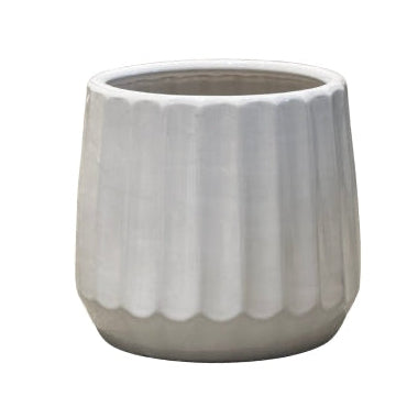 White ceramic planter with ribbed texture on a white background